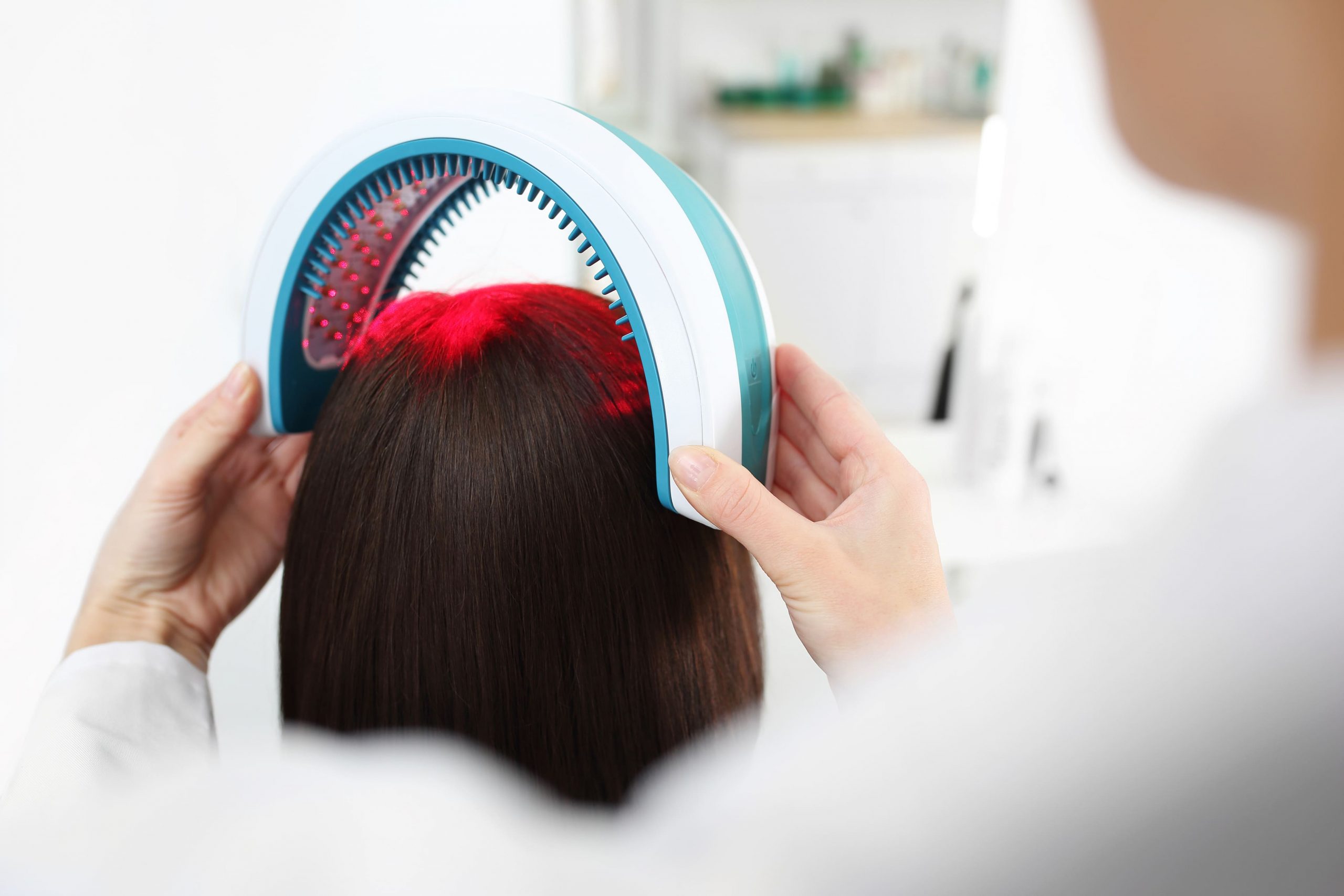 Hair treatment procedure being performed in a clinic environment