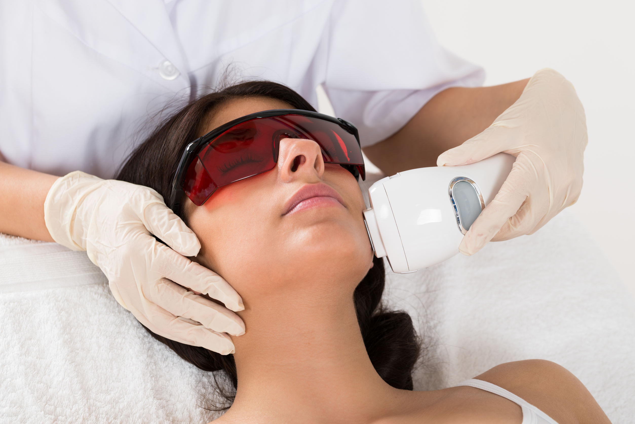Patient receiving rosacea-related skin care in a clinic setting
