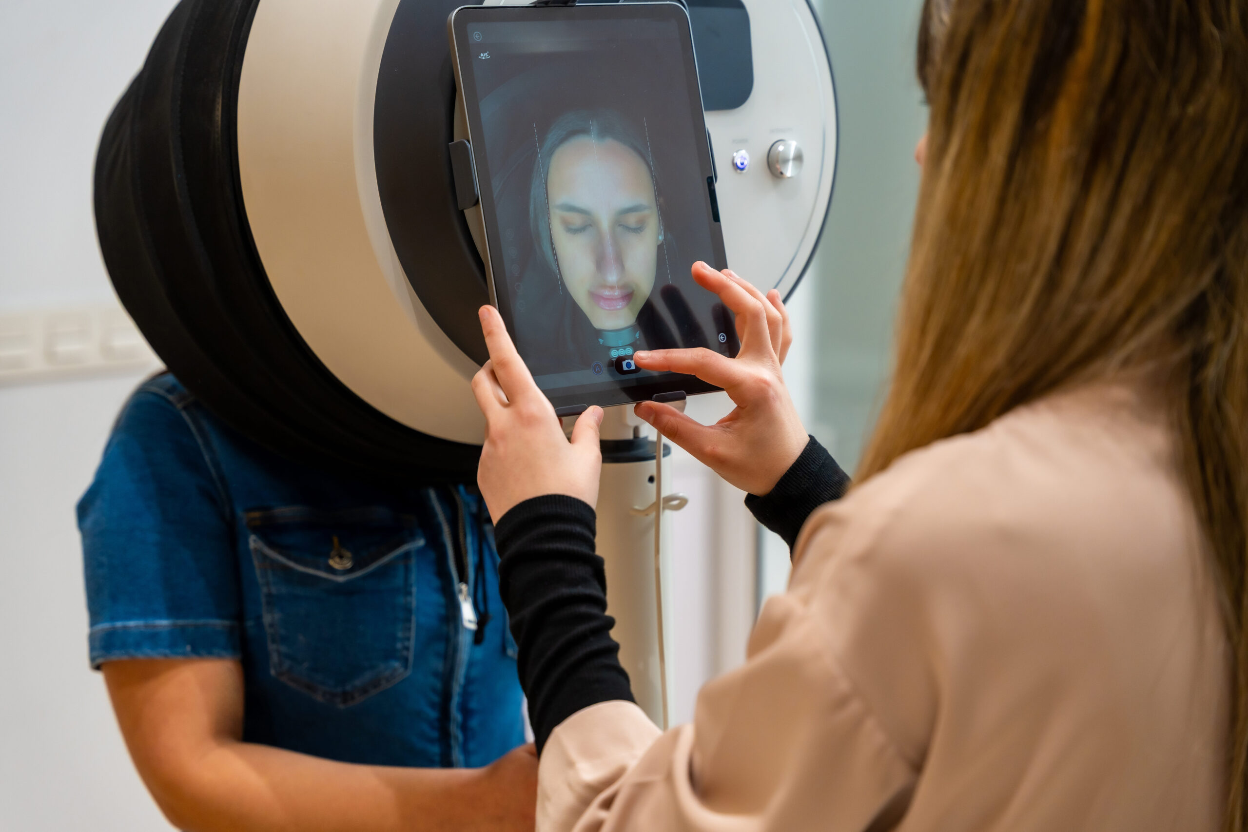 woman using tablet on facial scanning device 2026 04 06 16 57 08 utc 1 scaled